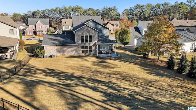 back of house with a yard