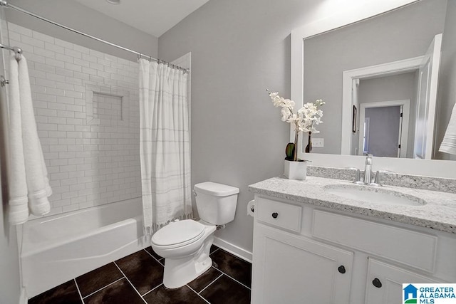 full bathroom featuring tile patterned floors, shower / tub combo with curtain, vanity, and toilet