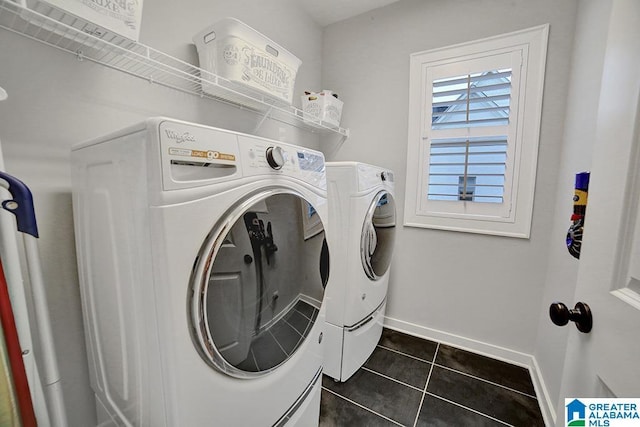 washroom featuring dark tile patterned floors and independent washer and dryer