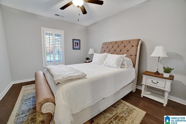 bedroom featuring ceiling fan and dark hardwood / wood-style flooring