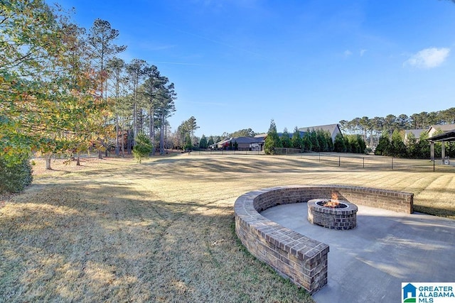 view of yard with a fire pit