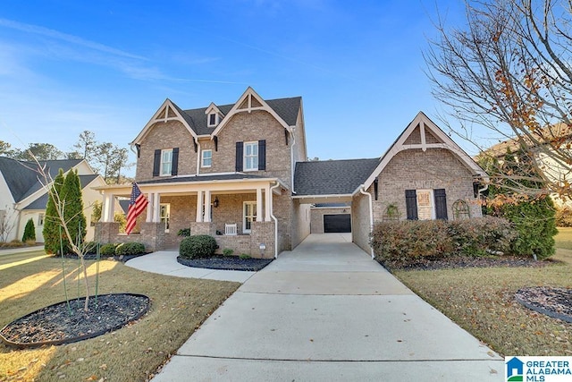 craftsman-style home with covered porch and a front yard