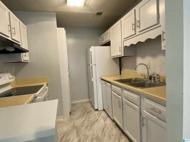 kitchen with white cabinets, range, stainless steel dishwasher, and sink