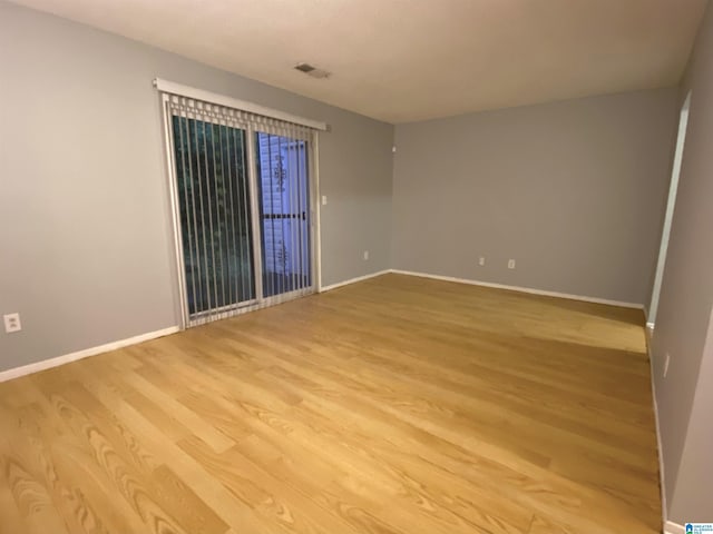 empty room with light hardwood / wood-style floors