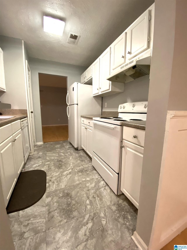 kitchen with a textured ceiling, white cabinetry, and white appliances