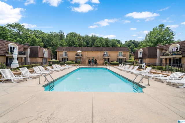 view of swimming pool with a patio