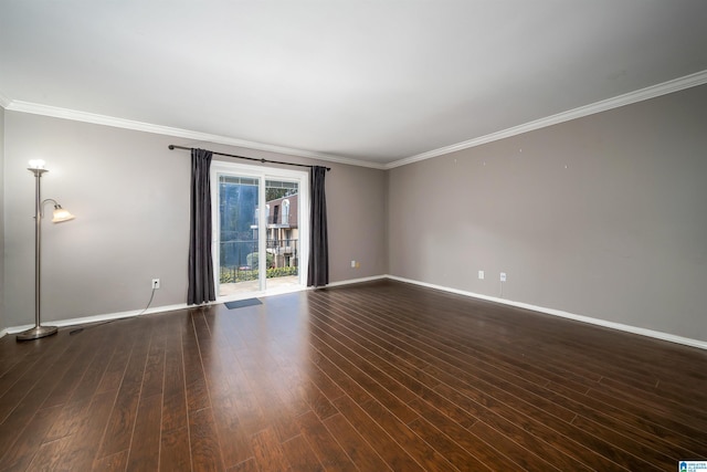 empty room with crown molding and dark hardwood / wood-style floors