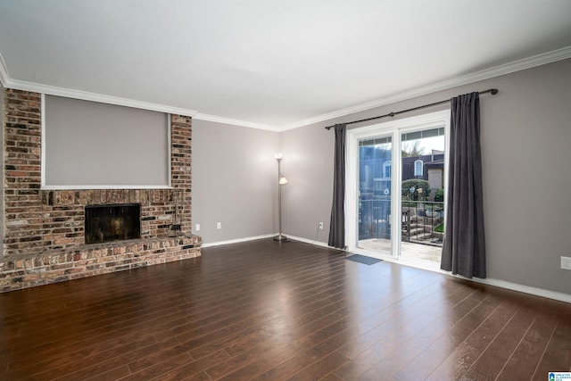 unfurnished living room with hardwood / wood-style flooring, crown molding, and a brick fireplace