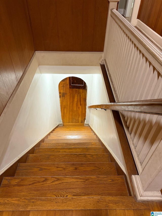 stairway featuring hardwood / wood-style flooring