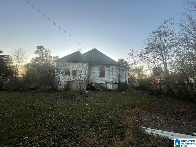 view of property exterior at dusk