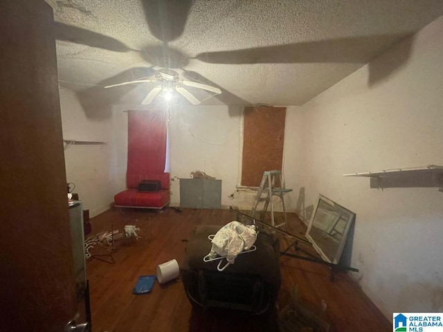 misc room featuring hardwood / wood-style floors and a textured ceiling