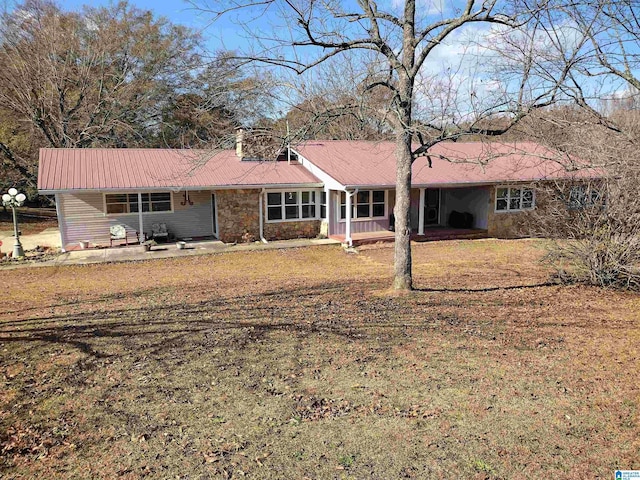 420 Dennis St, Weaver, AL 36277 - view of front of house with metal roof, a porch, an attached carport, and a front lawn