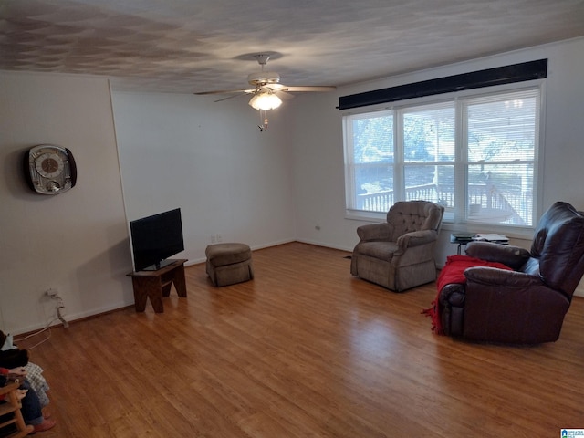 unfurnished living room featuring hardwood / wood-style floors and ceiling fan