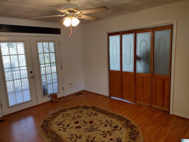 interior space with ceiling fan, access to exterior, light hardwood / wood-style flooring, and french doors