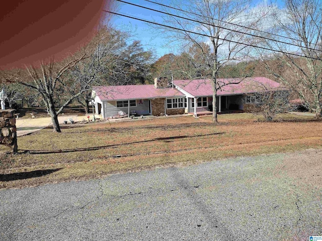 420 Dennis St, Weaver, AL 36277 - ranch-style house featuring covered porch and a chimney