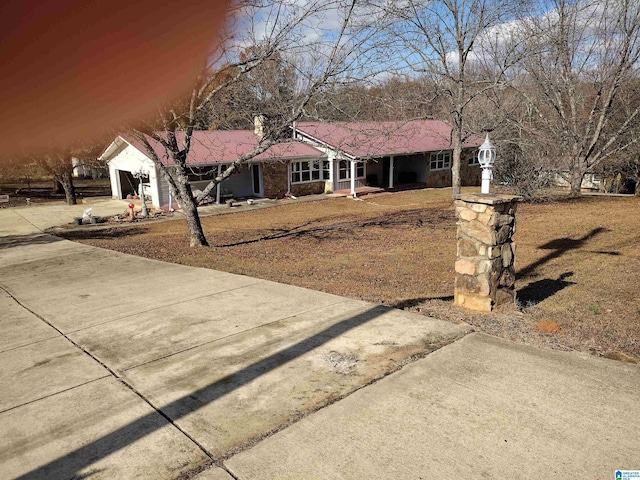420 Dennis St, Weaver, AL 36277 - ranch-style home with covered porch, a front lawn, and driveway