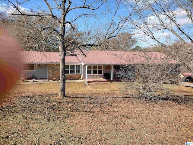 ranch-style house with a front lawn