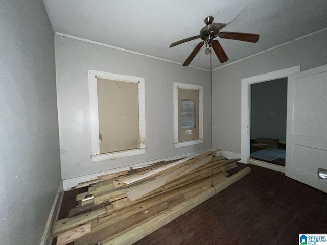 unfurnished bedroom with hardwood / wood-style flooring, ceiling fan, and crown molding