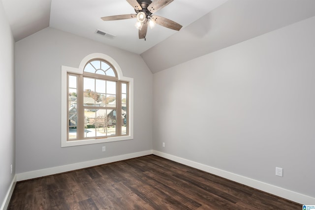 spare room with ceiling fan, dark hardwood / wood-style flooring, and lofted ceiling