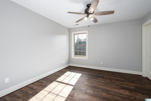 unfurnished room featuring ceiling fan and dark wood-type flooring