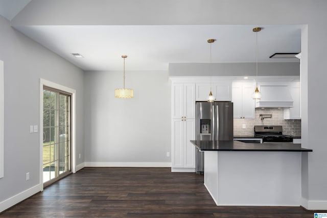 kitchen with dark wood-type flooring, premium range hood, pendant lighting, white cabinets, and appliances with stainless steel finishes