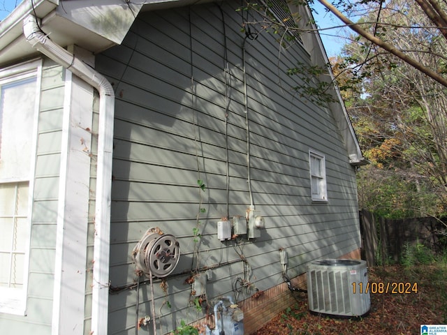 view of side of home with cooling unit