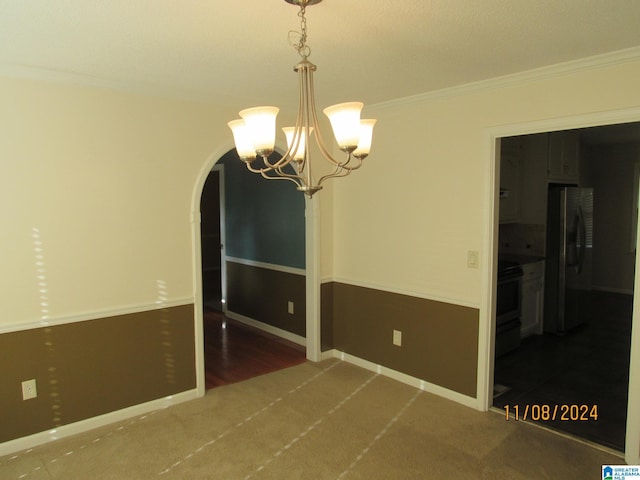 interior space featuring crown molding, dark carpet, and a notable chandelier