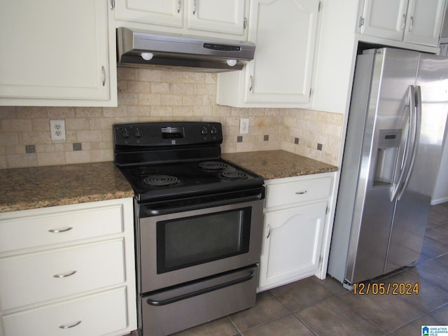 kitchen with stainless steel fridge, black electric range, white cabinets, and extractor fan