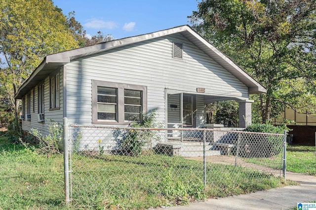 view of side of home featuring a yard