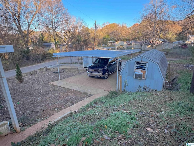 501 S Ledbetter St, Anniston, AL 36201 - view of parking with a detached carport and driveway