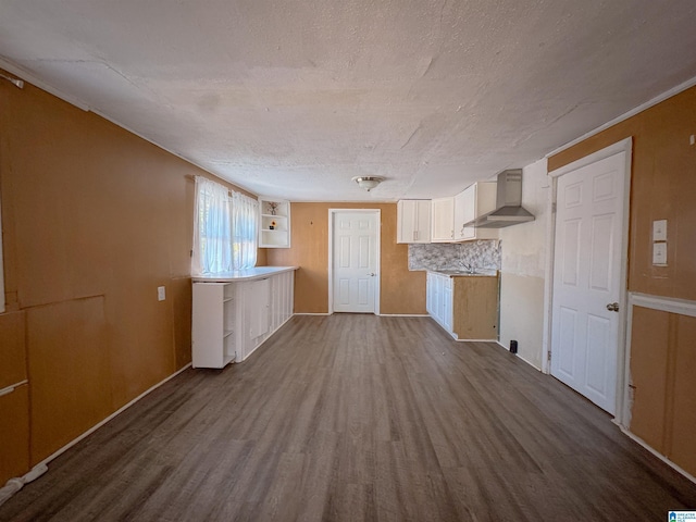 501 S Ledbetter St, Anniston, AL 36201 - kitchen with wall chimney range hood, dark wood-style floors, white cabinets, open shelves, and a textured ceiling