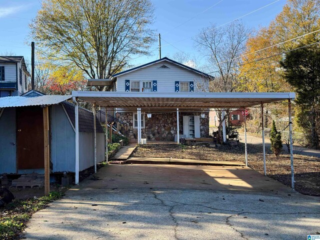 501 S Ledbetter St, Anniston, AL 36201 - view of car parking featuring driveway and a detached carport