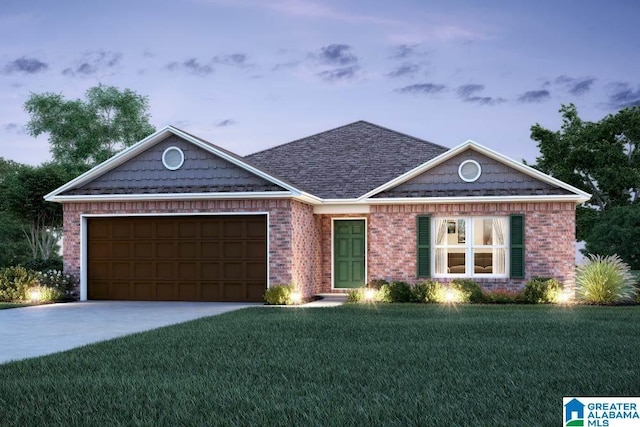 view of front of property featuring a yard and a garage