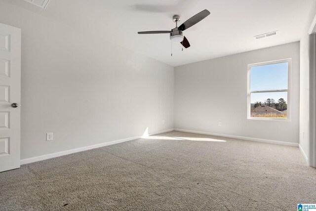 empty room featuring ceiling fan and carpet flooring