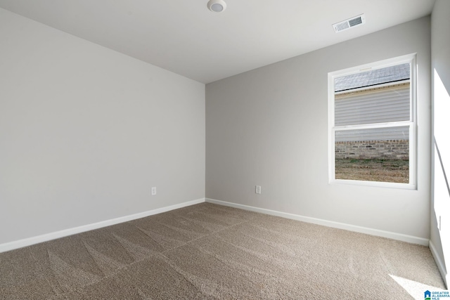 empty room featuring carpet floors