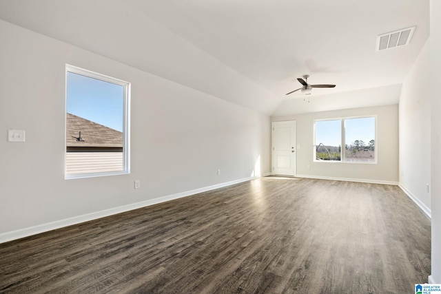 spare room featuring ceiling fan, vaulted ceiling, and dark hardwood / wood-style floors