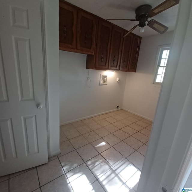 laundry area with cabinets, hookup for a washing machine, ceiling fan, hookup for an electric dryer, and light tile patterned flooring