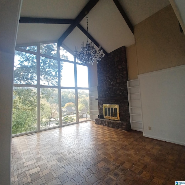 unfurnished living room featuring a fireplace, an inviting chandelier, high vaulted ceiling, and beamed ceiling