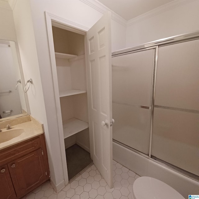 full bathroom with shower / bath combination with glass door, vanity, toilet, and crown molding