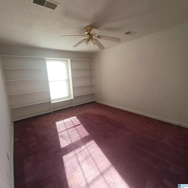 spare room with carpet floors and ceiling fan