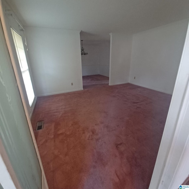 spare room featuring carpet flooring