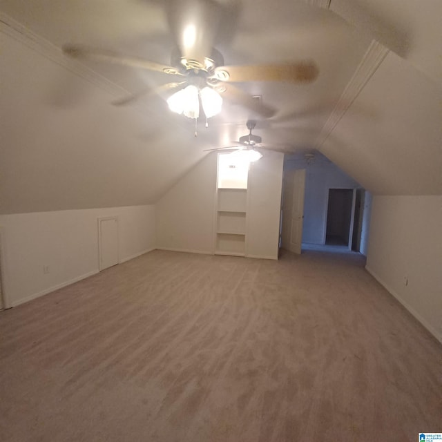 additional living space with carpet, vaulted ceiling, and ceiling fan