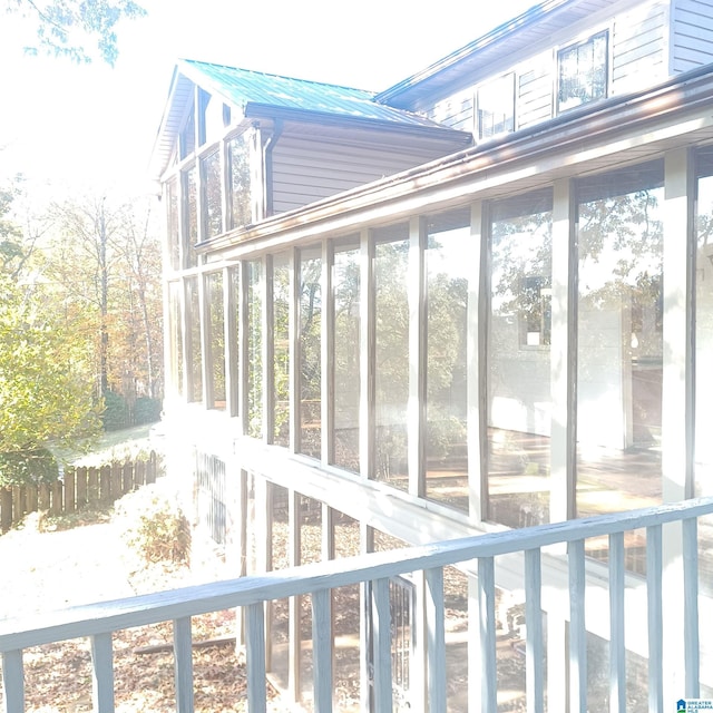 view of side of property featuring a sunroom