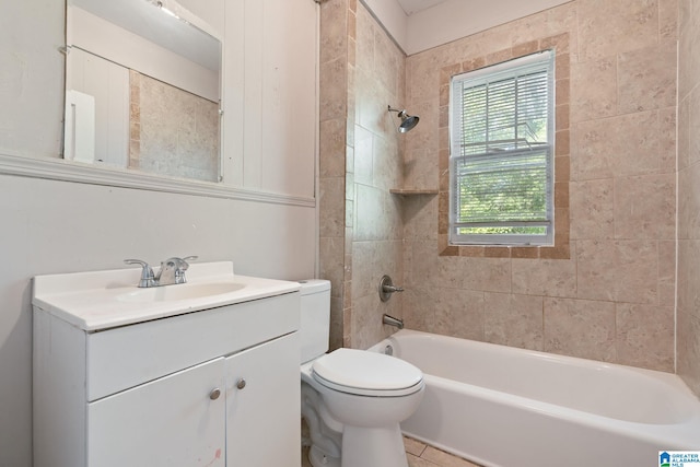 full bathroom featuring toilet, tile patterned floors, vanity, and tiled shower / bath combo