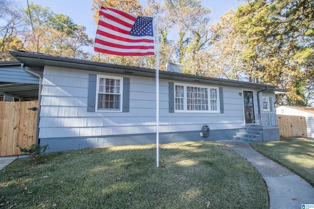 ranch-style home with a front lawn