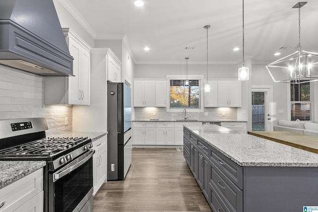 kitchen with premium range hood, a sink, white cabinetry, appliances with stainless steel finishes, and gray cabinets