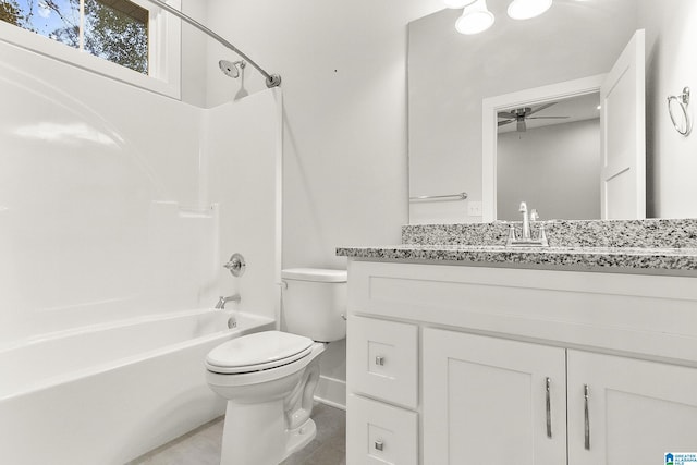 full bath with shower / bathtub combination, ceiling fan, vanity, and toilet