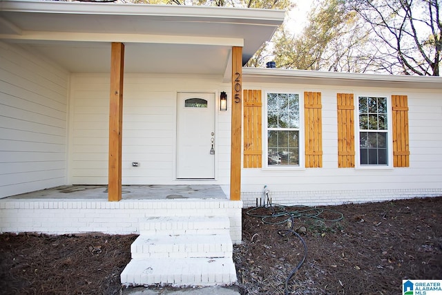 property entrance featuring covered porch