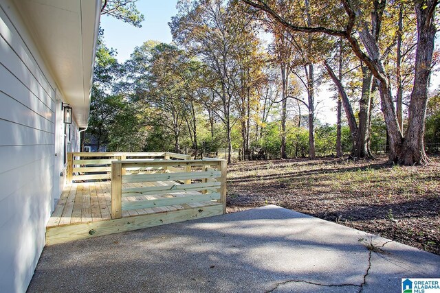 view of gate featuring a wooden deck