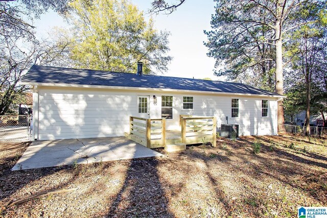 view of front of home with a patio area and central air condition unit